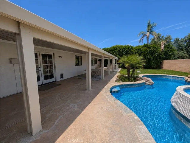 Image has been digitally enhanced to showcase what the backyard can potentially look like.  The backyard and pool and spa are in need of repair.