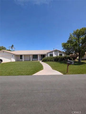 Image has been digitally enhanced to showcase what the front yard could look like.