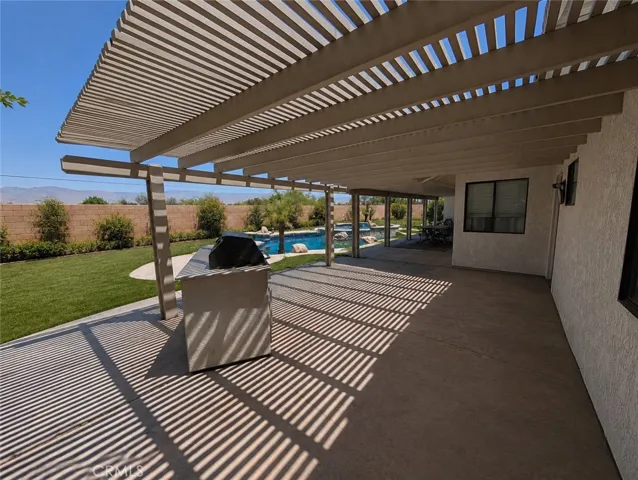 Image has been digitally enhanced to showcase what the backyard can potentially look like.  The backyard and pool and spa are in need of repair.