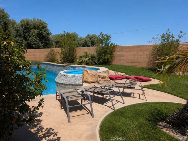 Image has been digitally enhanced to showcase what the backyard can potentially look like.  The backyard and pool and spa are in need of repair.