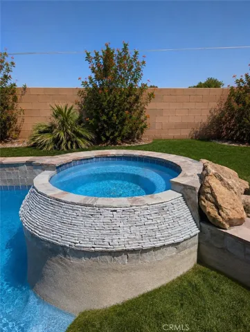 Image has been digitally enhanced to showcase what the backyard can potentially look like.  The backyard and pool and spa are in need of repair.