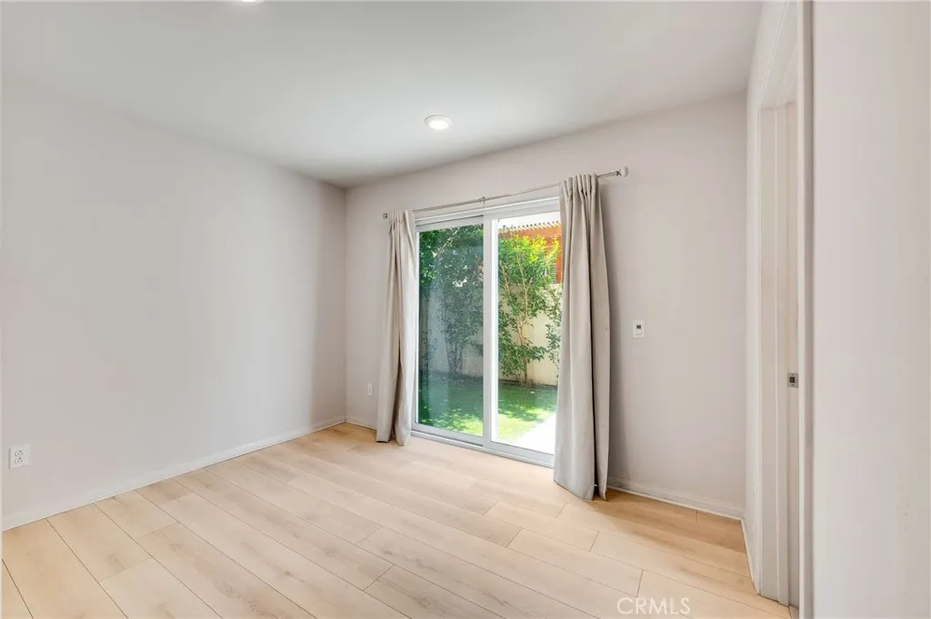 Lower level bedroom with access to backyard