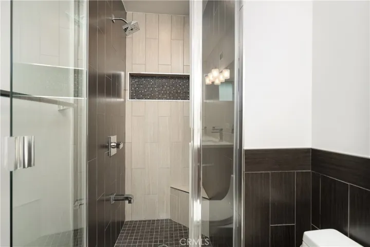 Primary Bath with glass shower enclosure & dual sinks