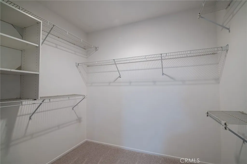 Walk-in closet in the primary bathroom.