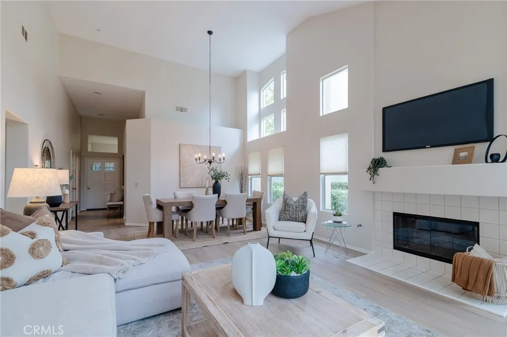 The living room also features a fireplace and vinyl flooring.