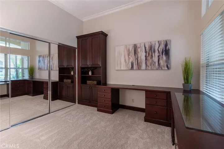 The secondary bedroom, currently used as an office, offers new carpet and built in desk with​​‌​​​​‌​​‌‌​​‌​​​‌‌​​​‌​​‌‌​​‌‌​​‌‌​​​​ cabinets.