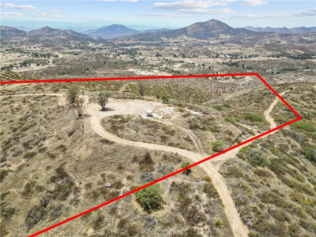 Approximate lot lines have been added to photos for reference only and are not intended to represent exact property boundaries. Buyers are advised to verify all property lines and dimensions independently.