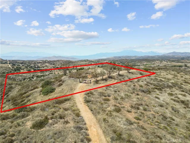Approximate lot lines have been added to photos for reference only and are not intended to represent exact property boundaries. Buyers are advised to verify all property lines and dimensions independently.