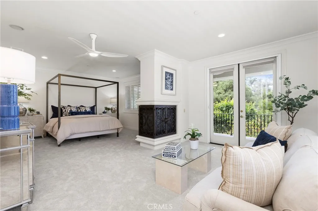 Bedroom 3-Spacious Primary bedroom suite featuring a cozy fireplace and direct access to a private balcony with private views galore