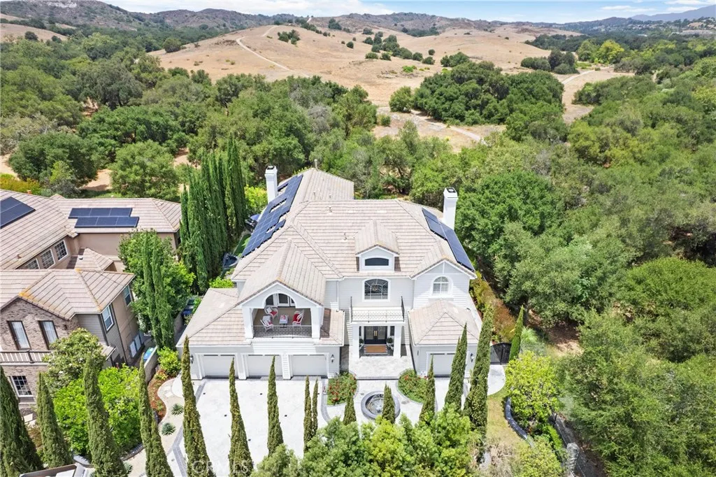 stunning views, surrounded by lush landscaping and open countryside.