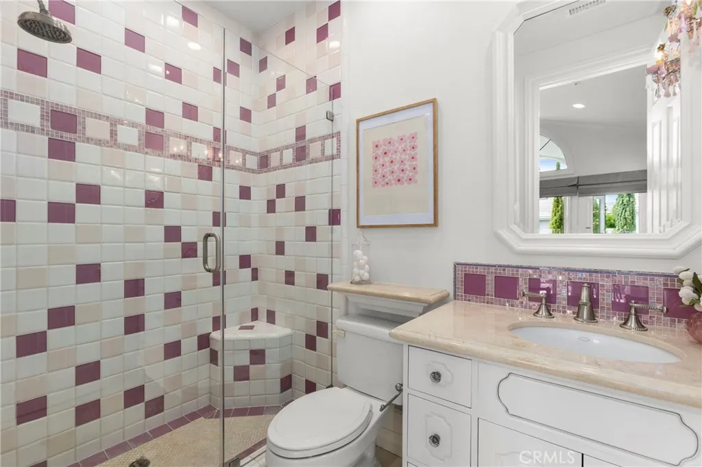 Bedroom 4-Private En-Suite Bath featuring a unique tile design, modern fixtures, and a spacious glass shower.