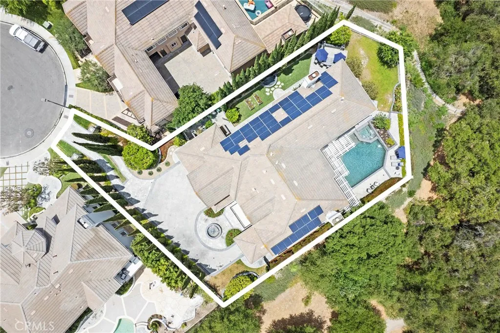 Spacious property featuring a solar-equipped home, pool, and landscaped outdoor areas in a private location.