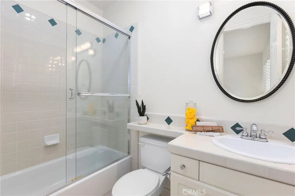 Bedroom 5's private en-suite bathroom featuring modern fixtures and a practical layout for everyday convenienc