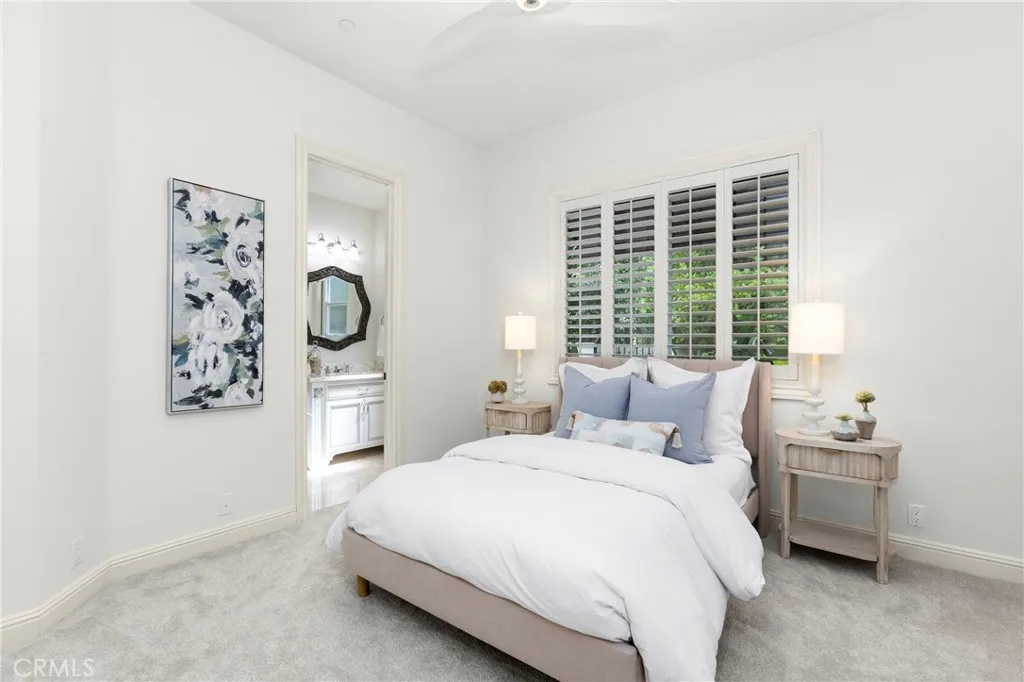 Downstairs Bedroom 1
Bright and inviting bedroom featuring soft decor, modern finishes, and natural light filtering through plantation shutters