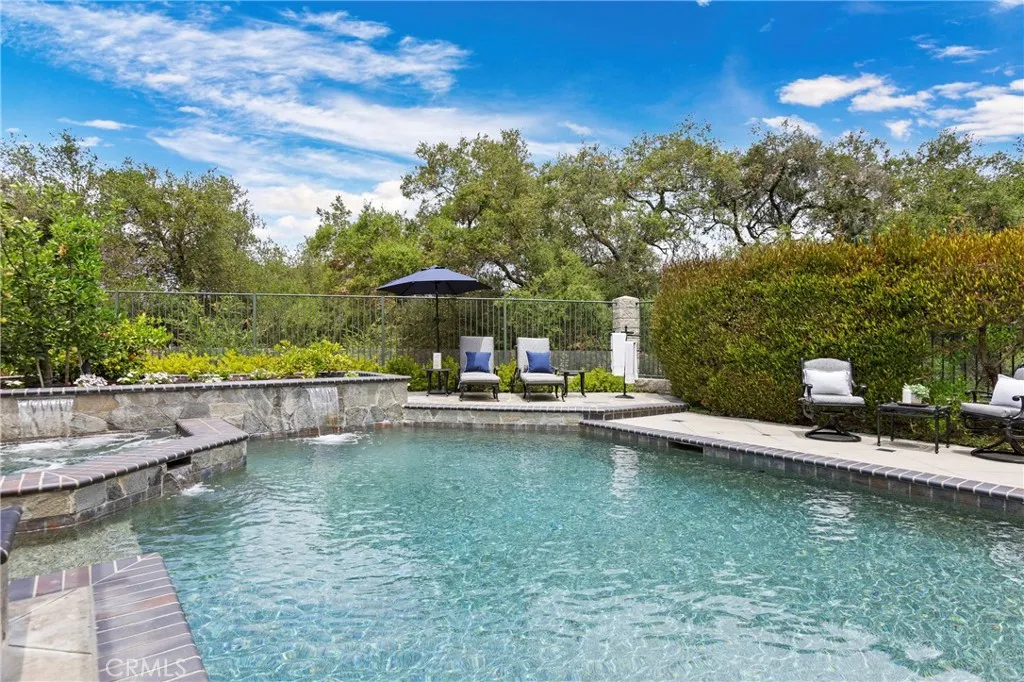 Discover your private oasis with a luxurious pool and tranquil landscaping, perfect for relaxation and entertaining.