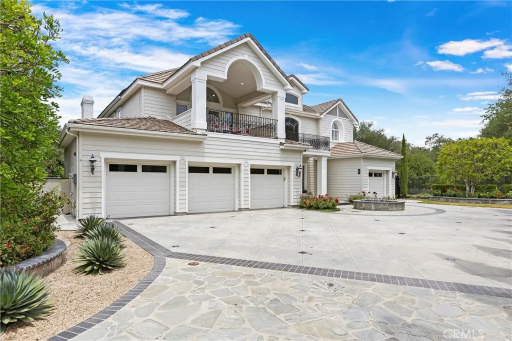Stunning Oak Knoll Summit home featuring 4 spacious garages and beautifully landscaped grounds, perfect for entertaining and outdoor living.