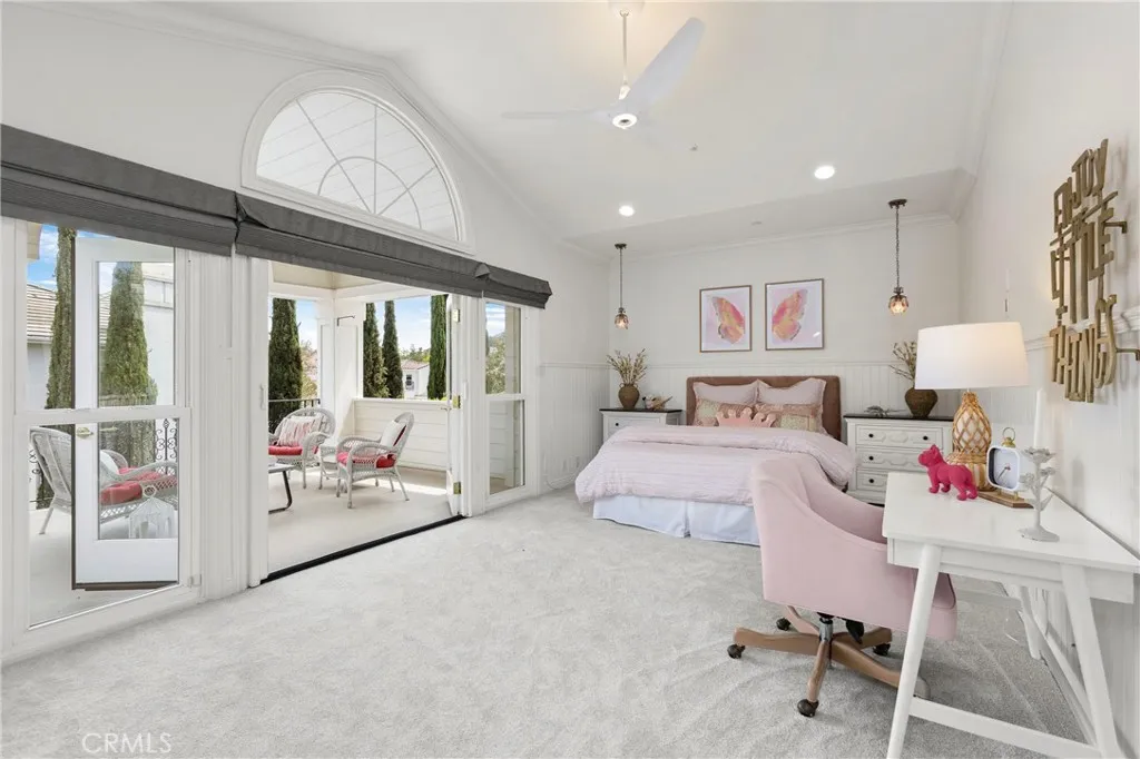Bedroom 4-Bright and airy bedroom featuring a cozy sitting area, large windows, and modern furnishings with direct access to you own private front balcony.
