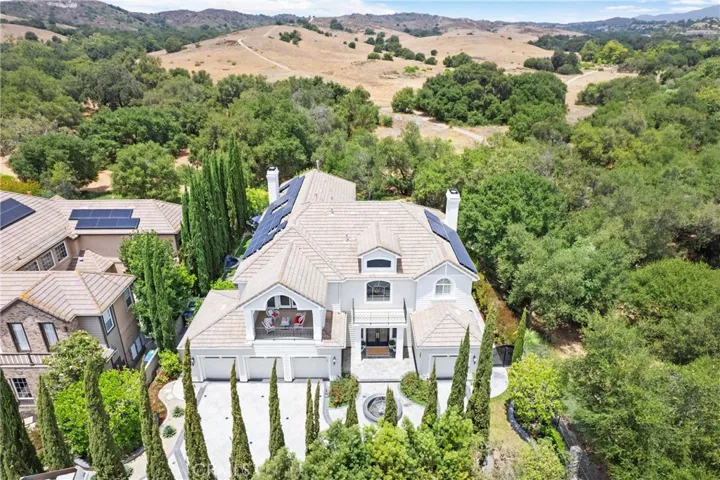 stunning views, surrounded by lush landscaping and open countryside.