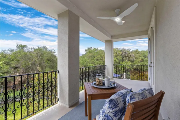 Primary Bedroom Private and Spacious balcony with scenic views, perfect for outdoor relaxation and enjoying nature's beauty.