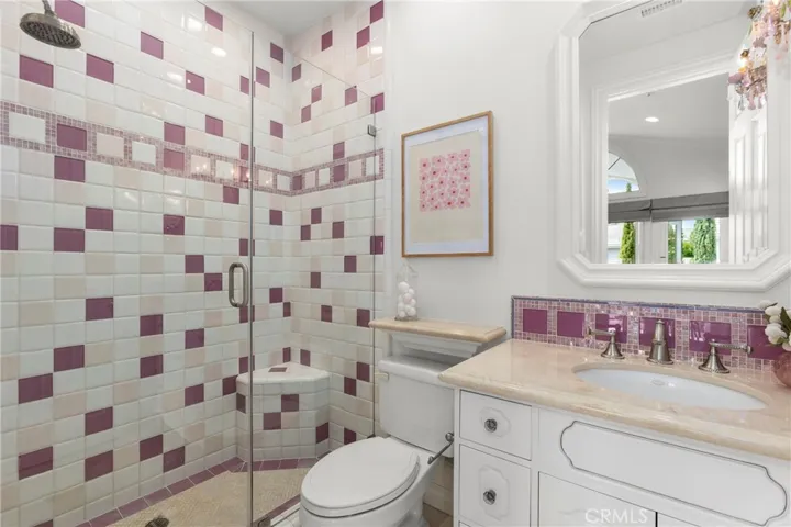 Bedroom 4-Private En-Suite Bath featuring a unique tile design, modern fixtures, and a spacious glass shower.