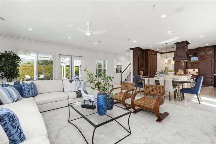 Bright, open-concept living space featuring modern furnishings, large windows, and seamless indoor-outdoor connectivity.