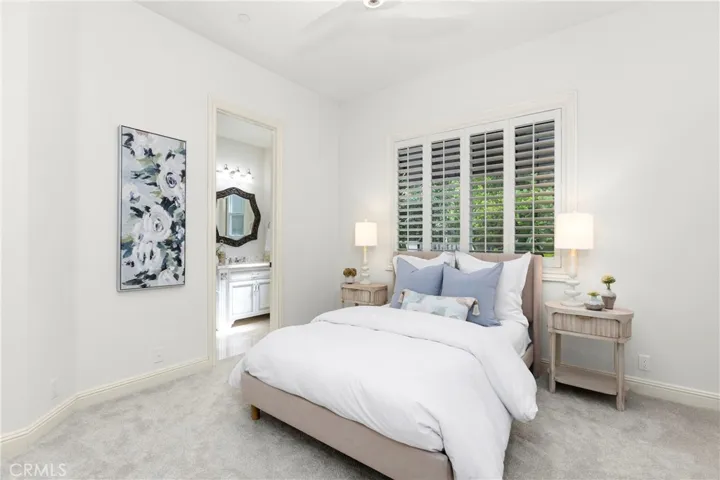 Downstairs Bedroom 1
Bright and inviting bedroom featuring soft decor, modern finishes, and natural light filtering through plantation shutters