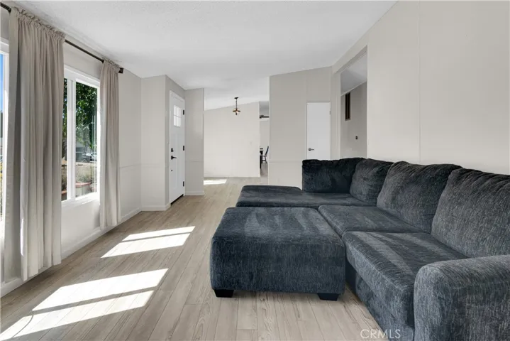 Living room from sliding glass door. Large oversized couch.