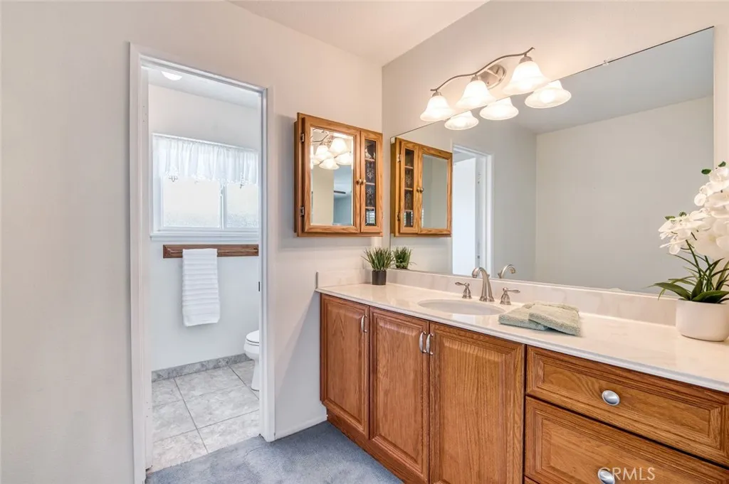 En-suite bathroom for primary suite with walk-in shower.