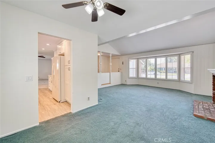 Dining room with direct kitchen access and living room with southern exposure.