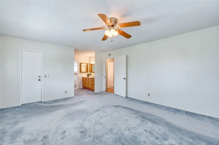 Second floor primary suite with en-suite bathroom and large walk-in closet.