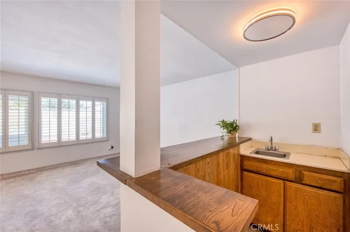 Spacious family room, complete with a wet bar, offering comfortable everyday living and easy hosting.