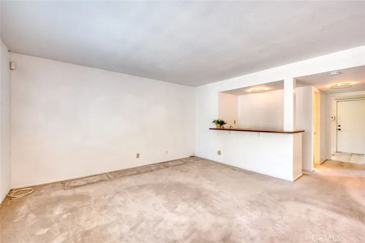 Spacious family room, complete with a wet bar, offering comfortable everyday living and easy hosting.