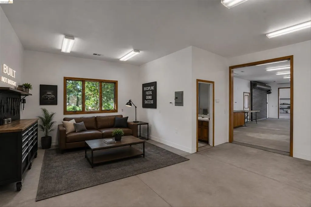Versatile interior space featuring concrete flooring and white walls