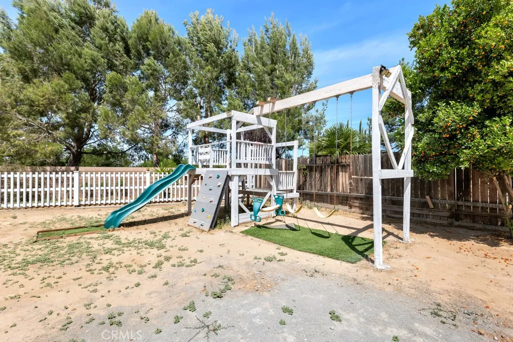 9,000+ lot size with playground, fruit trees