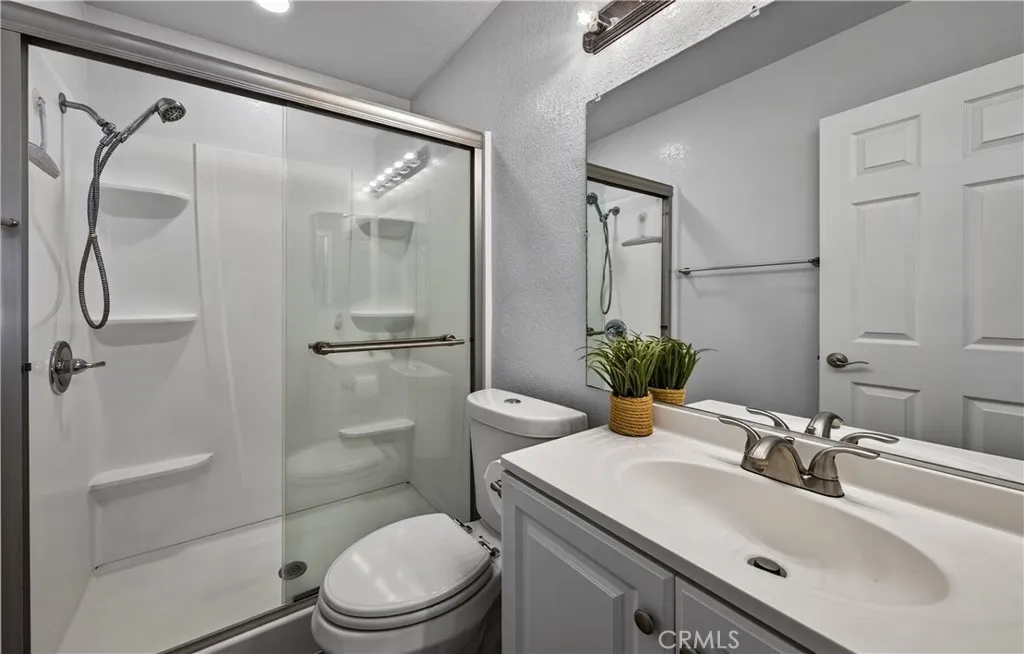 Bathroom in primary suite has newer bathroom completely remodeled.