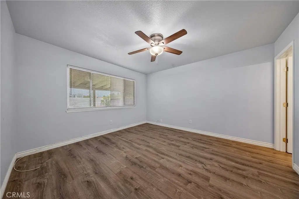 Primary bedroom has a lighted fan and ensuite bathroom.