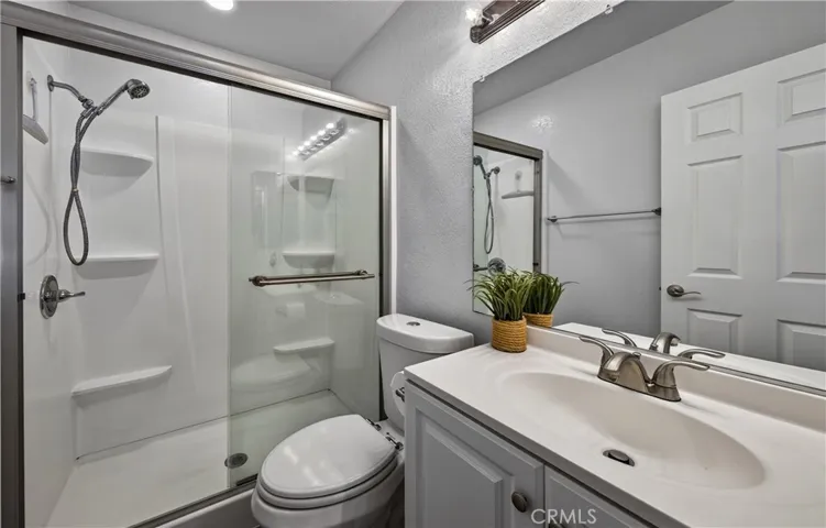 Bathroom in primary suite has newer bathroom completely remodeled.