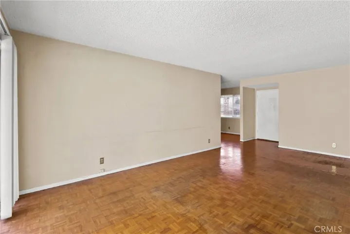 View of living room looking toward front door.