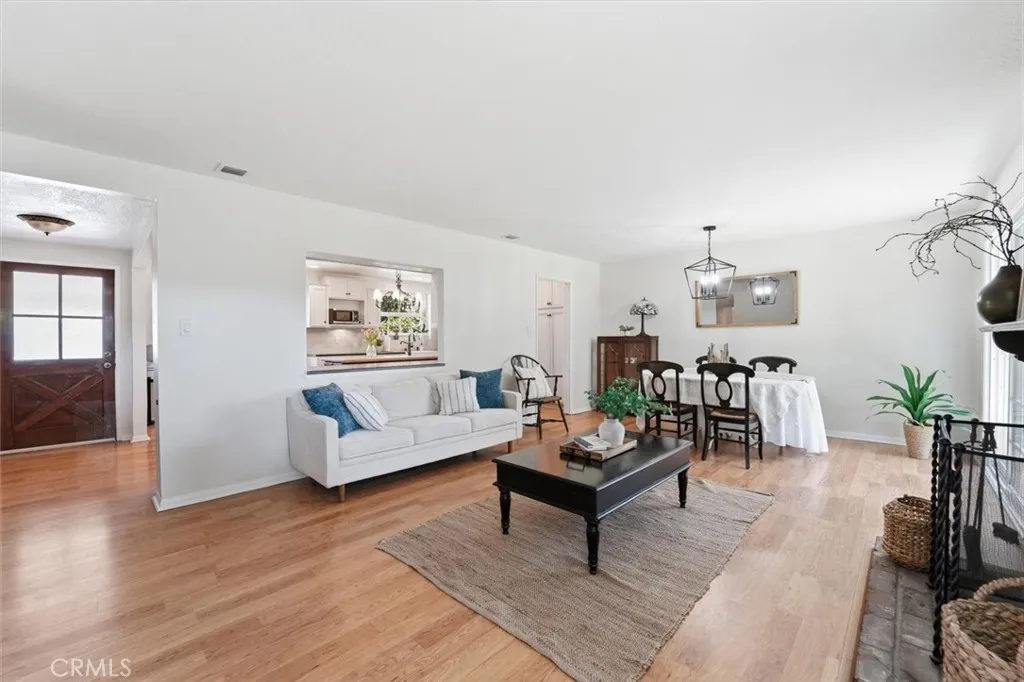 Spacious living room which opens to kitchen, dining area and yard