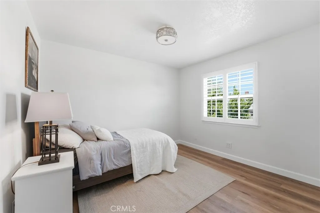 Upstairs bedroom with window and shutters