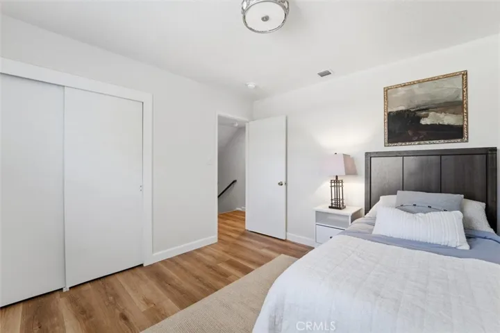 Upstairs bedroom with new luxury vinyl flooring