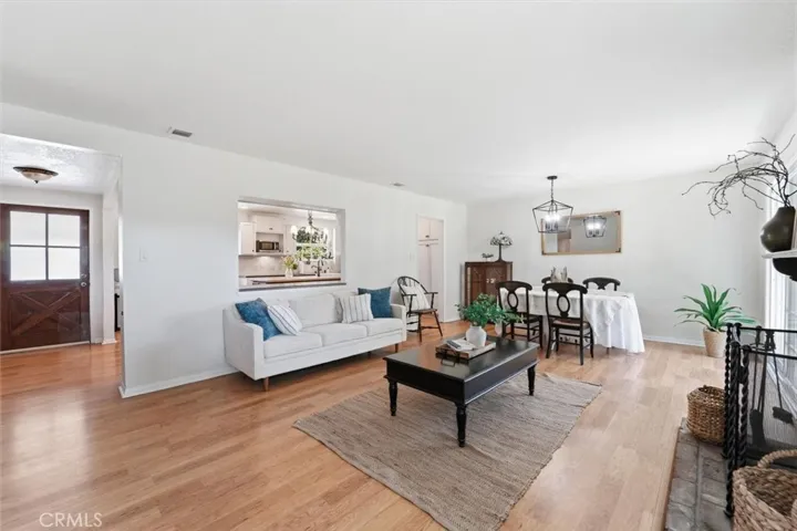 Spacious living room which opens to kitchen, dining area and yard