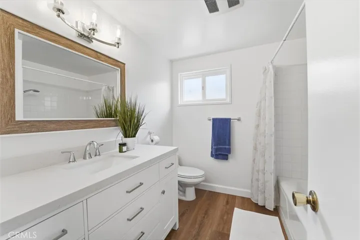 Upstairs hall bath with new vanity, mirror and lights