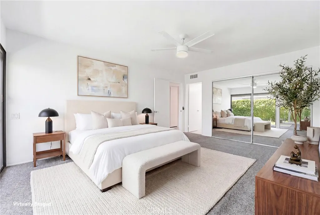 Primary bedroom with double closets and a slider to the gated privagte yard