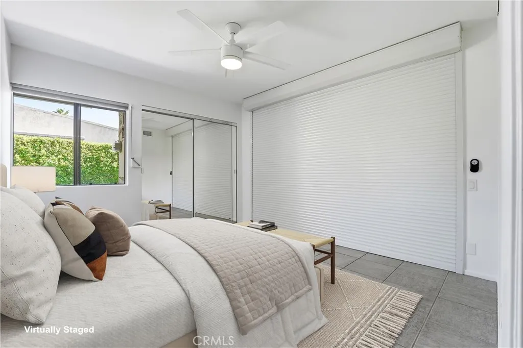 2nd bedroom with a custom motorized wall that can be open to the living area, making an ideal office or den option