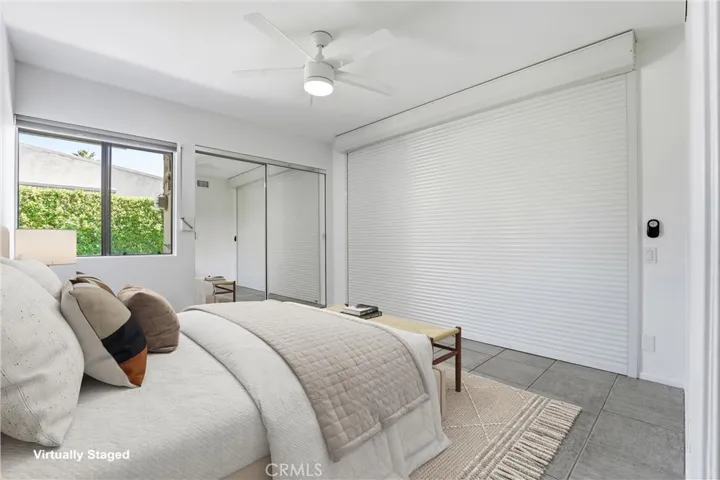 2nd bedroom with a custom motorized wall that can be open to the living area, making an ideal office or den option