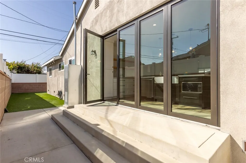 Folding glass doors from the kitchen to the dog run