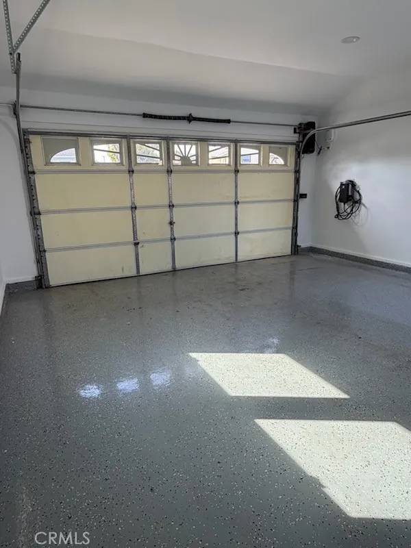 Garage upgrades include: EV charger (level 2), finished walls and epoxy flooring, recessed lights and attic space