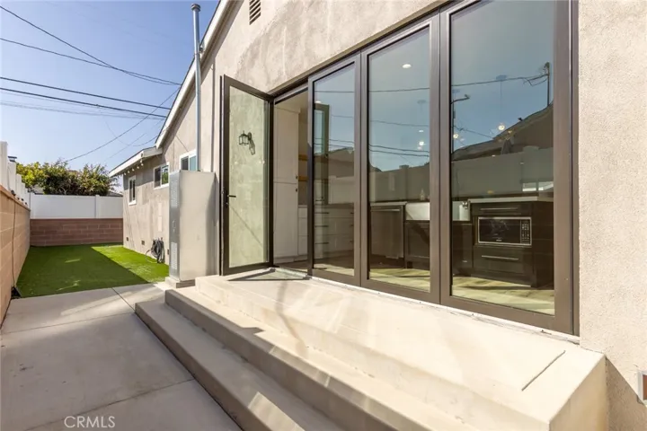 Folding glass doors from the kitchen to the dog run