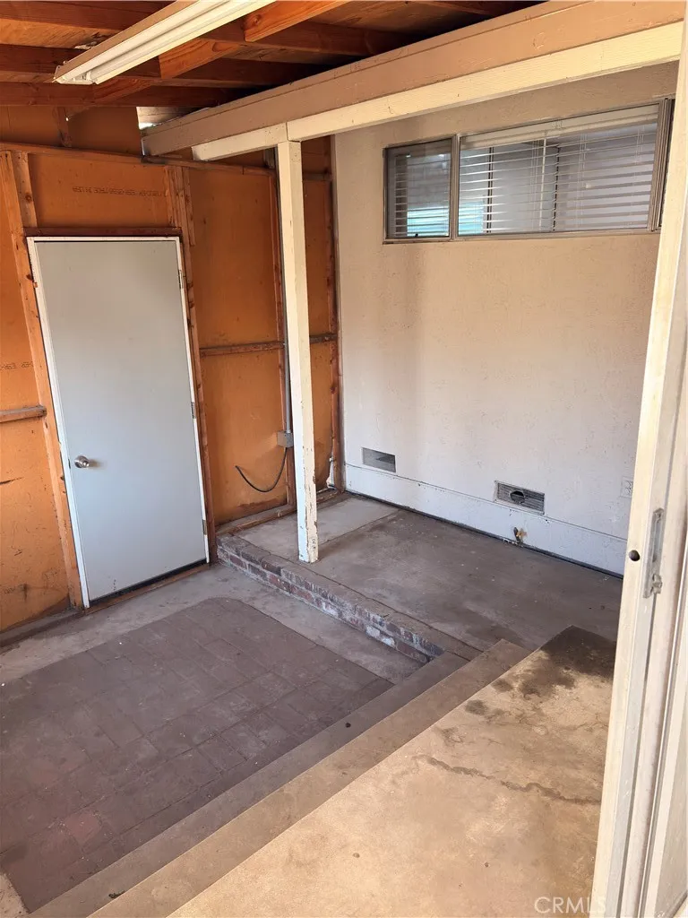 Laundry hook up inside  a separate room at the back of the house